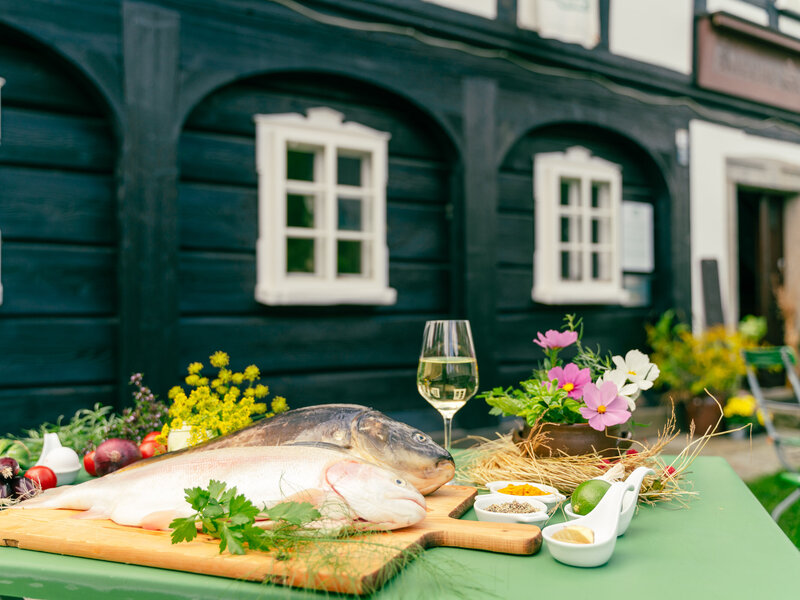 Carp in front of a half-timbered house